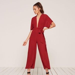 Reformation kimono sleeve swiss jumpsuit in red.